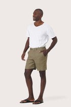 Side profile of the brown linen bermuda shorts showcasing their effortless fit