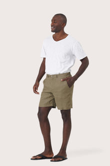 Side profile of the brown linen bermuda shorts showcasing their effortless fit