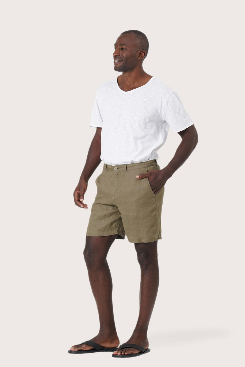 Side profile of the brown linen bermuda shorts showcasing their effortless fit