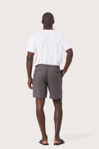 Back view of the grey brown linen bermuda shorts with a relaxed and tailored silhouette