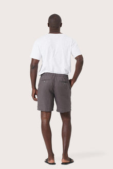 Back view of the grey brown linen bermuda shorts with a relaxed and tailored silhouette