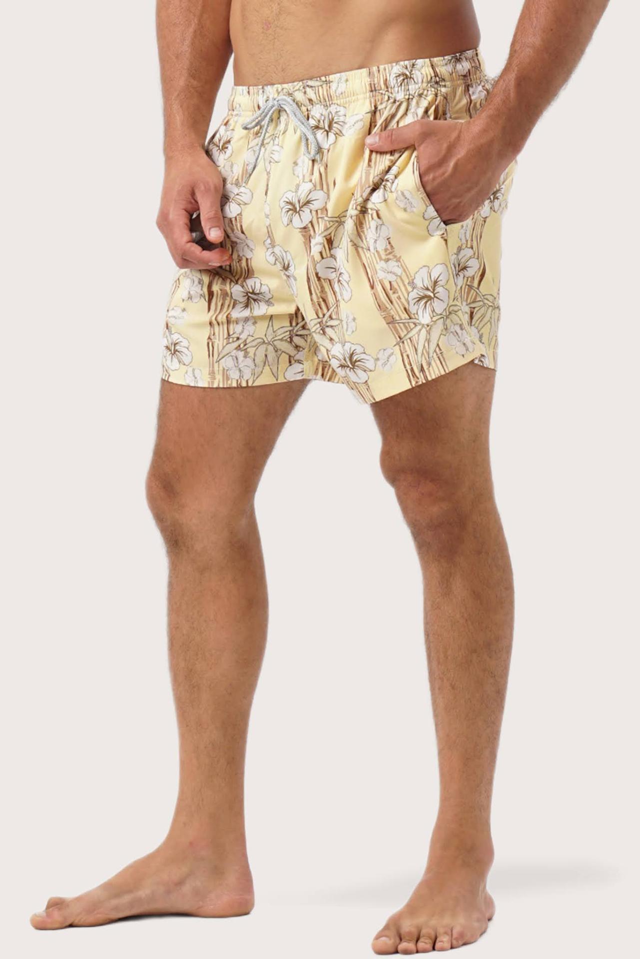 Side profile of Kamboja Swim Trunk highlighting its tailored resortwear design