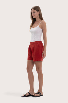 Lightweight linen bermuda shorts designed for refined tropical dressing