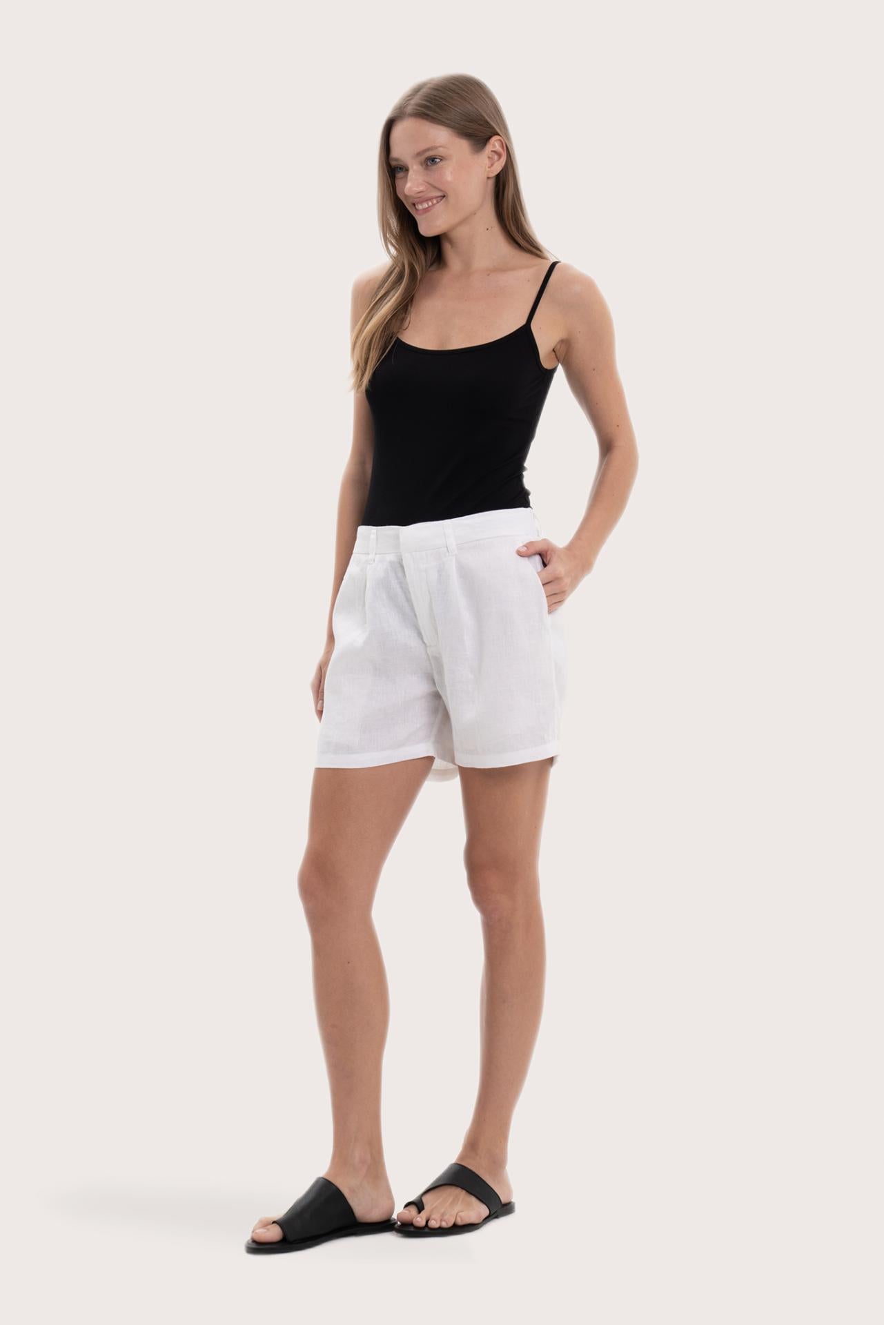 Lightweight linen bermuda shorts designed for refined tropical dressing