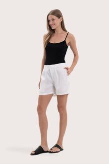 Lightweight linen bermuda shorts designed for refined tropical dressing