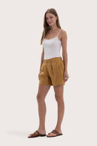 Lightweight linen bermuda shorts designed for refined tropical dressing