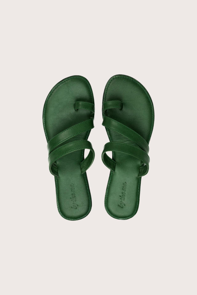 Kawula sandal in forest green shown in a global view highlighting its full silhouette and refined resort design