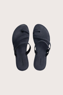 Kawula sandal in navy shown in a global view highlighting its full silhouette and refined resort design
