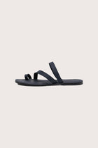 Side profile of Kawula sandal in navy highlighting sleek and modern resort footwear silhouette