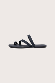 Side profile of Kawula sandal in navy highlighting sleek and modern resort footwear silhouette