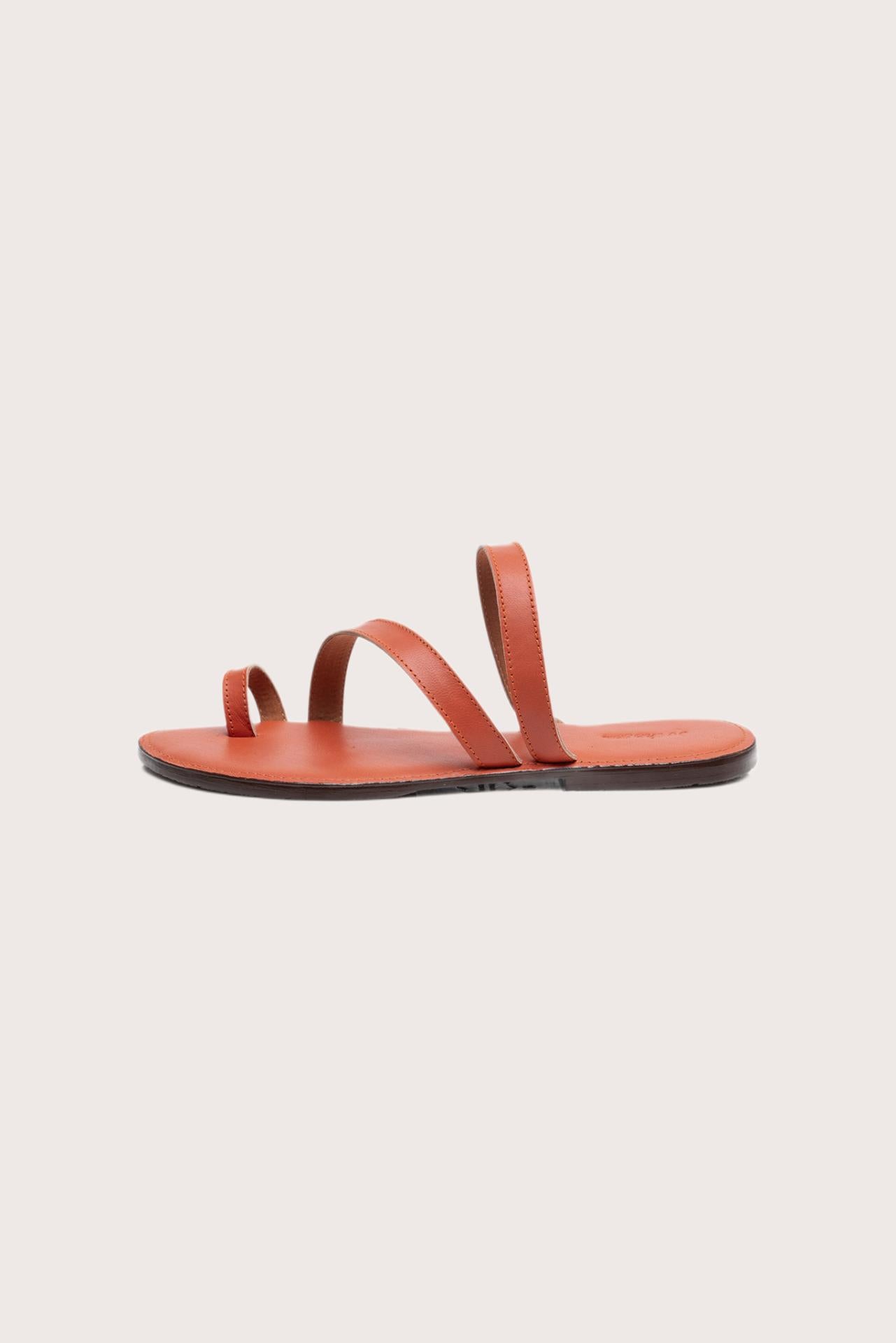 Side profile of Kawula sandal in orange highlighting sleek and modern resort footwear silhouette
