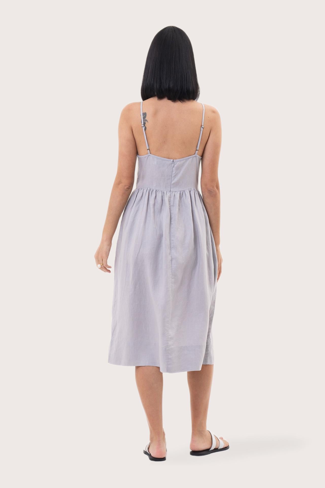 Back view of the Kei Linen Breeze Midi Dress Grey highlighting the garment shape and drape