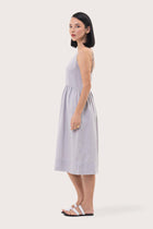 Side profile of the Kei Linen Breeze Midi Dress Grey showing its cut and natural movement