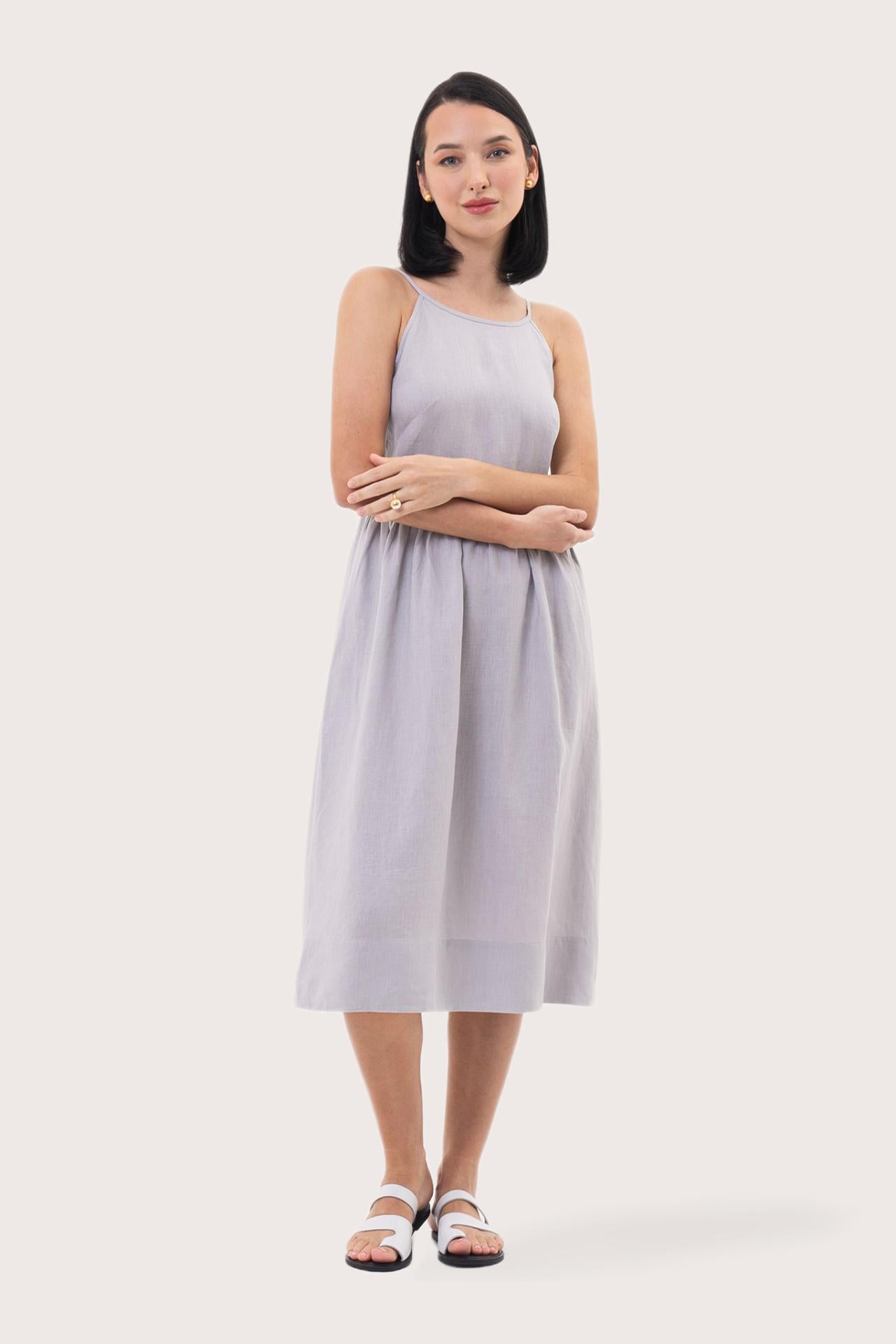 Woman wearing the Kei Linen Breeze Midi Dress Grey designed for effortless resortwear and tropical living by By The Sea Bali