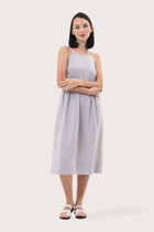 Woman wearing the Kei Linen Breeze Midi Dress Grey designed for effortless resortwear and tropical living by By The Sea Bali