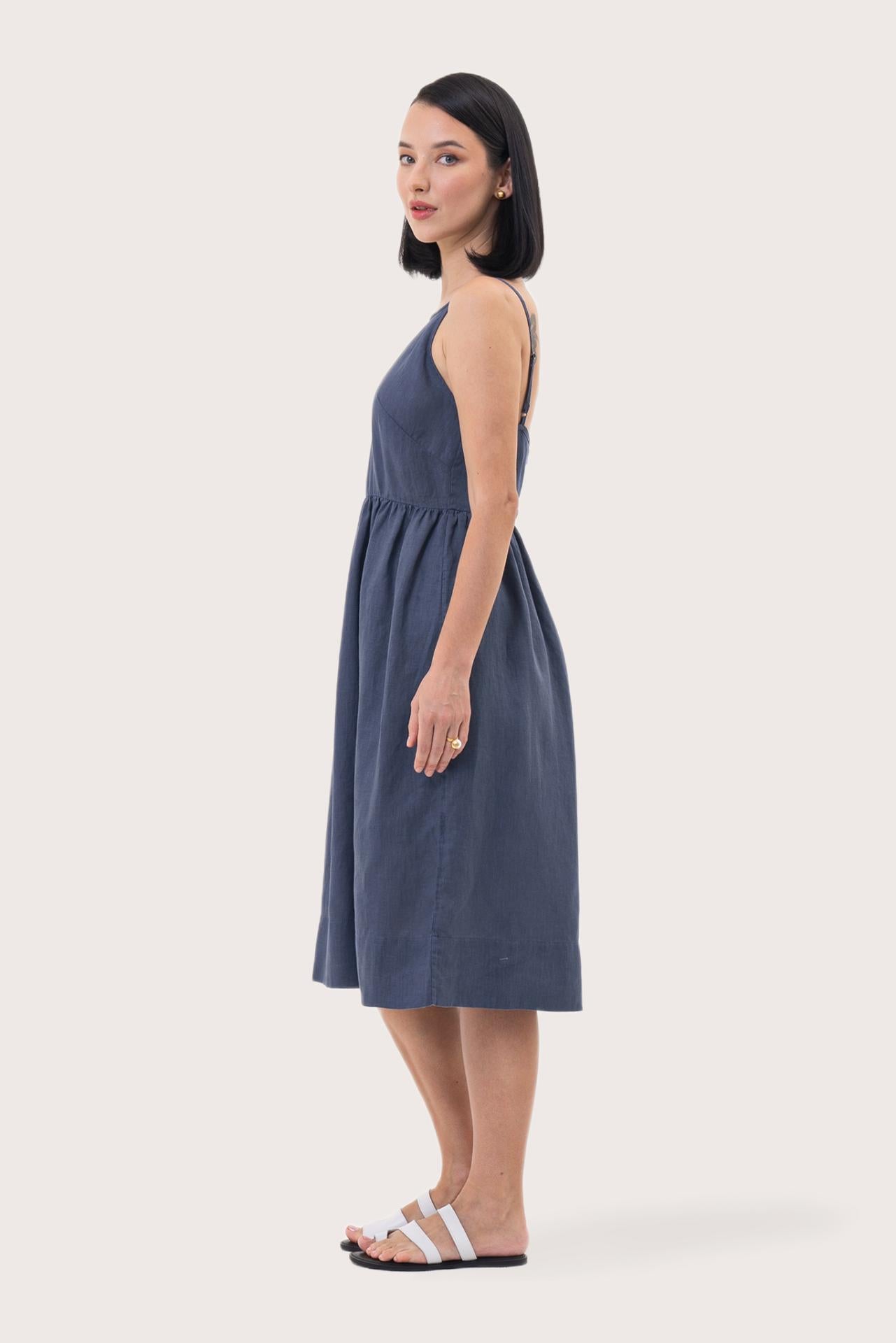 Back view of the Kei Linen Breeze Midi Dress Indigo highlighting the garment shape and drape