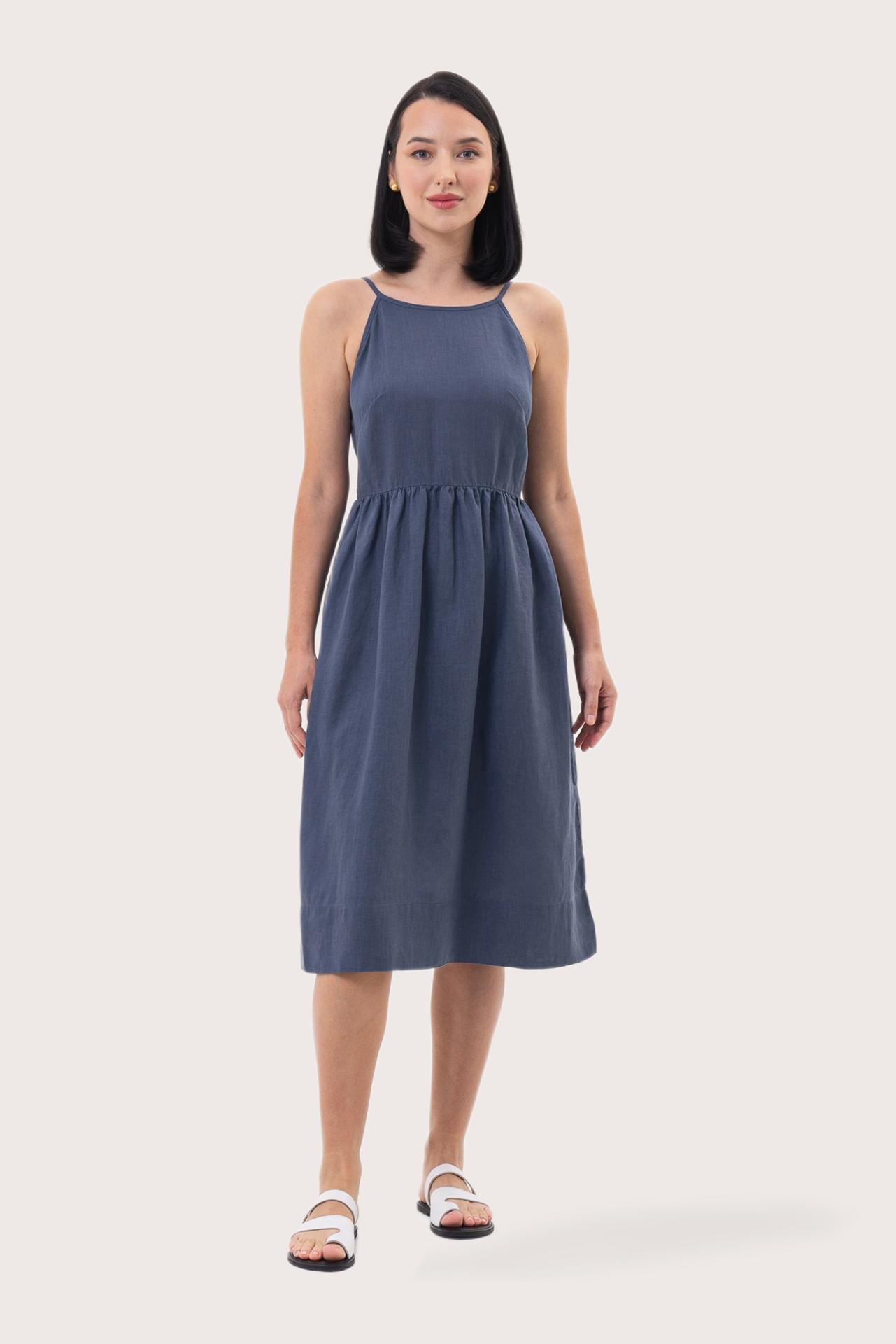 Woman wearing the Kei Linen Breeze Midi Dress Indigo designed for effortless resortwear and tropical living by By The Sea Bali