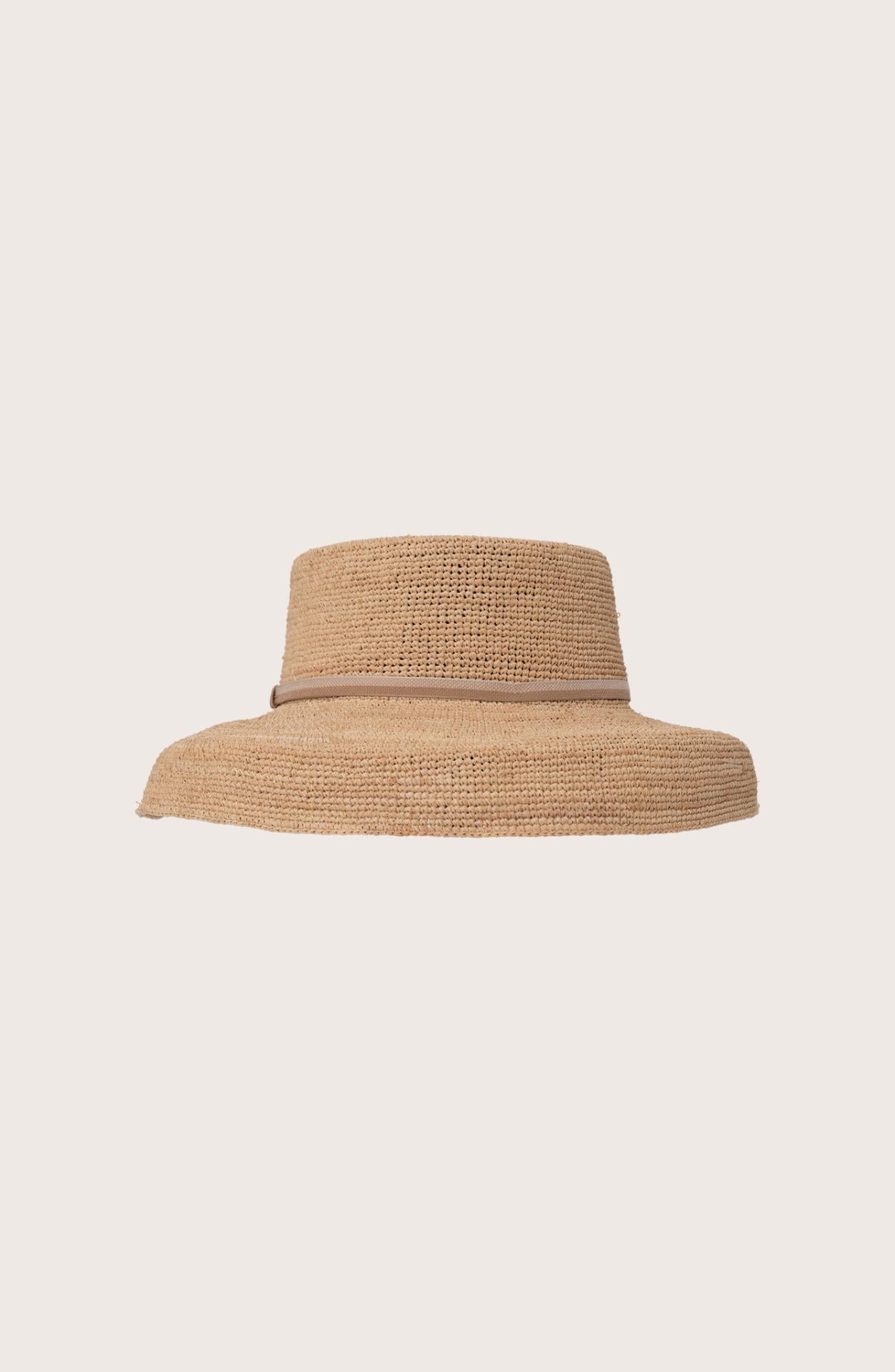 Side profile of the natural straw Keira hat showcasing its classic wide-brim silhouette
