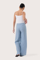 Back view of the Kerang Linen Pant Light Blue highlighting the garment shape and drape.
