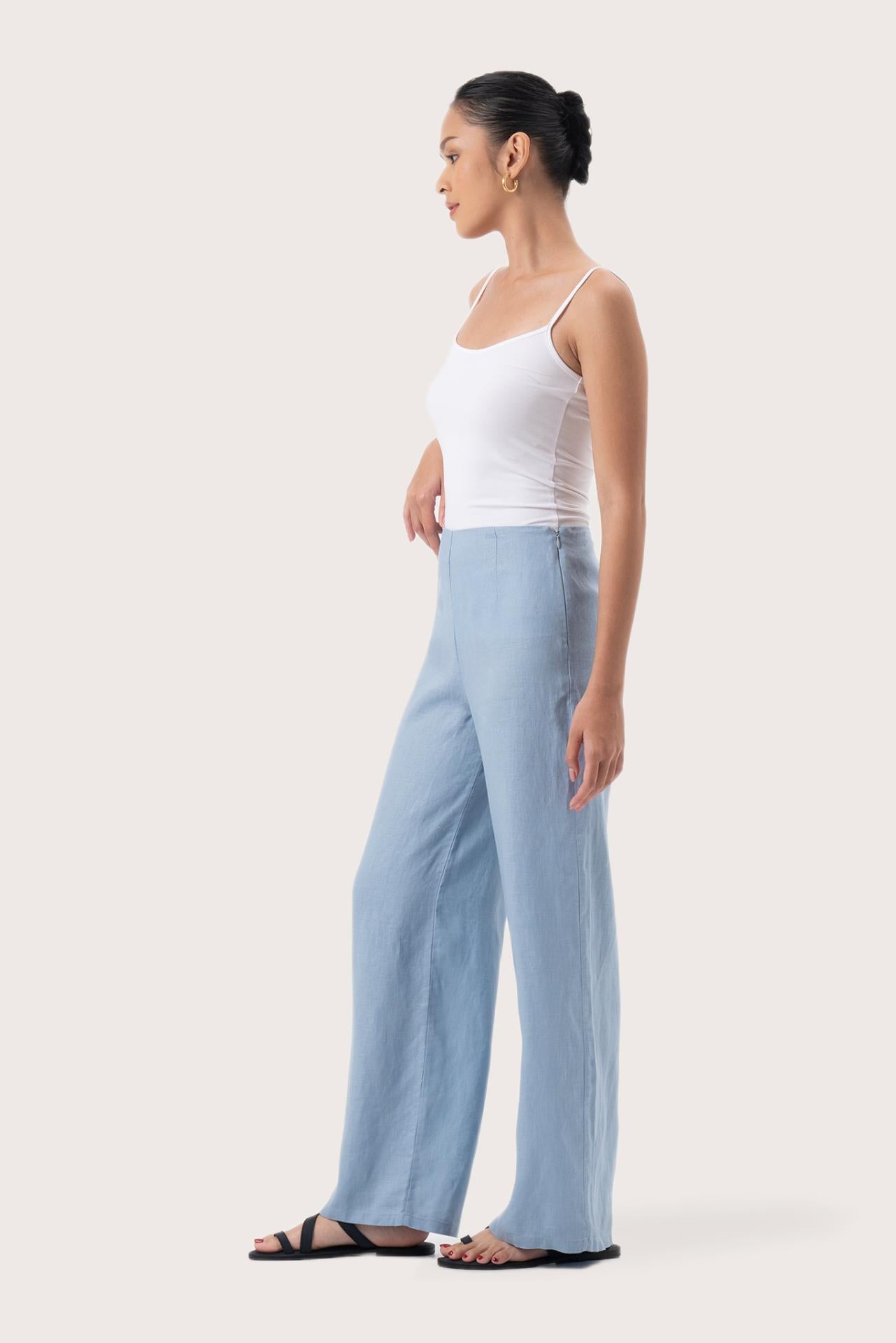 Side profile of the Kerang Linen Pant Light Blue showing its cut and natural movement.