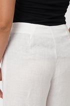 Close up detail of the Kerang Linen Pant Off White highlighting craftsmanship and design features.
