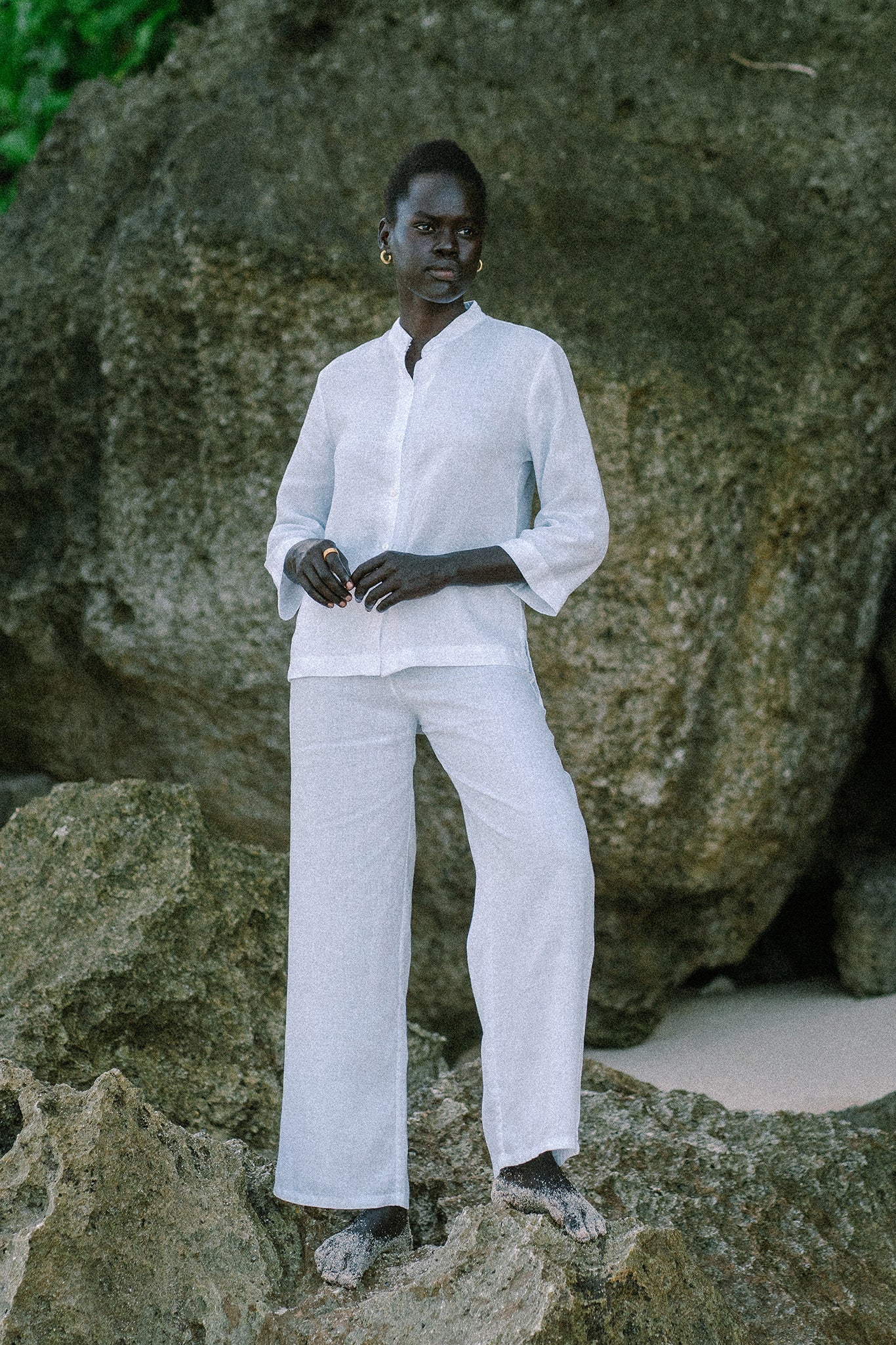 Woman wearing the Kerang Linen Pant Off White designed for effortless resortwear and tropical living by By The Sea Bali.