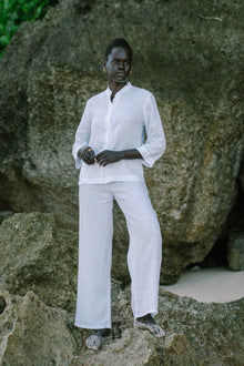 Woman wearing the Kerang Linen Pant Off White designed for effortless resortwear and tropical living by By The Sea Bali.