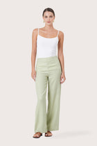 Woman wearing the Kerang Linen Pant Green designed for effortless resortwear and tropical living by By The Sea Bali.