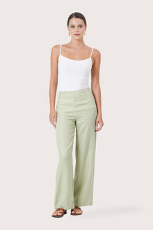 Woman wearing the Kerang Linen Pant Green designed for effortless resortwear and tropical living by By The Sea Bali.