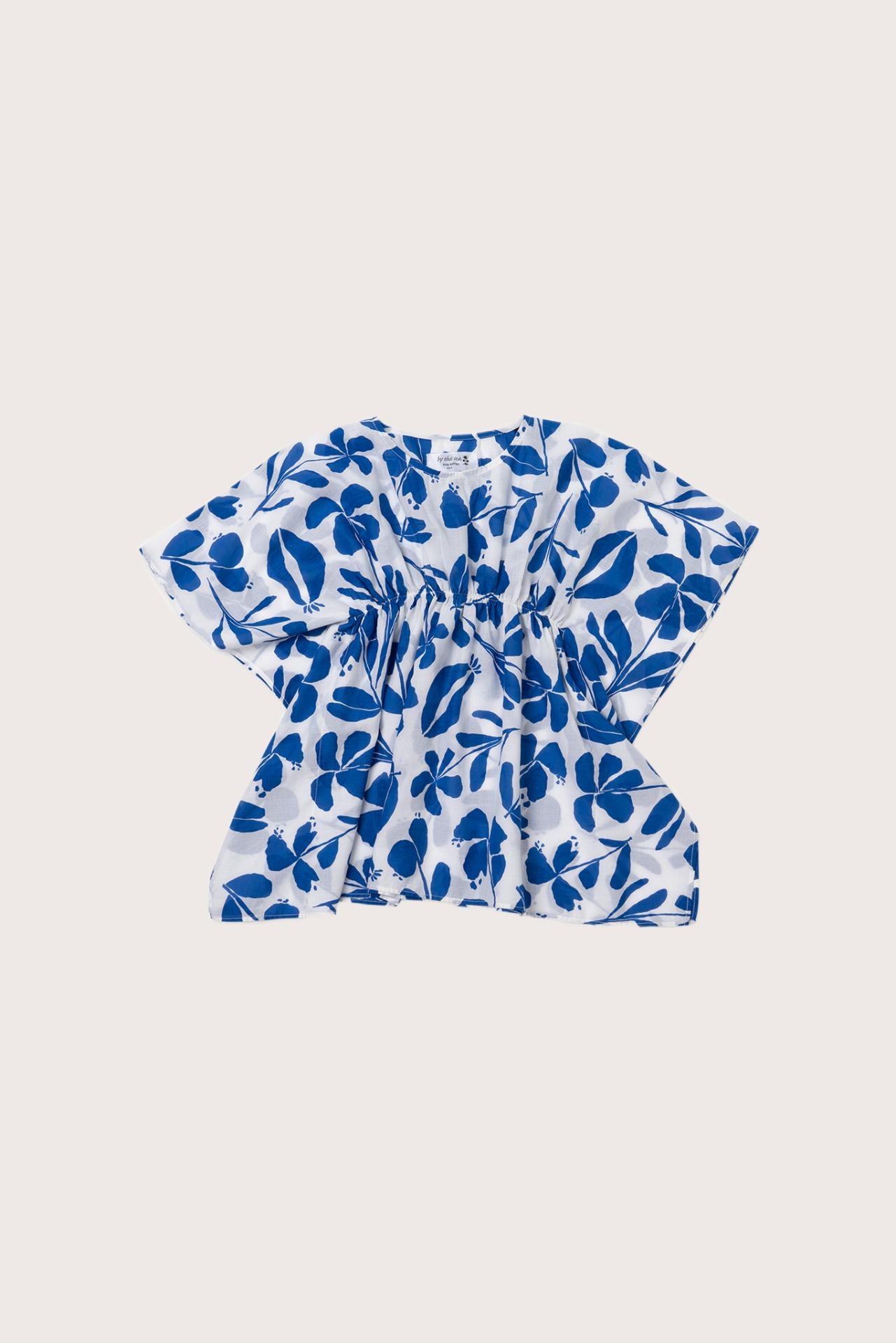 Child wearing the blue white cotton Kids Kaftan by By The Sea Bali