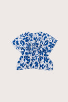 Child wearing the blue white cotton Kids Kaftan by By The Sea Bali
