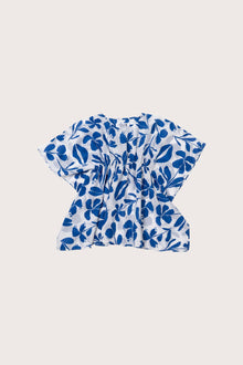 Child wearing the blue white cotton Kids Kaftan by By The Sea Bali