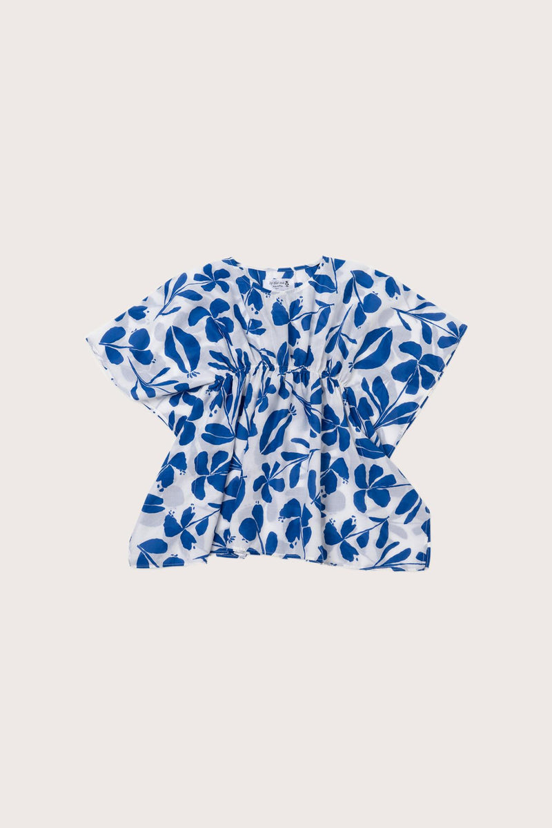 Child wearing the blue white cotton Kids Kaftan by By The Sea Bali