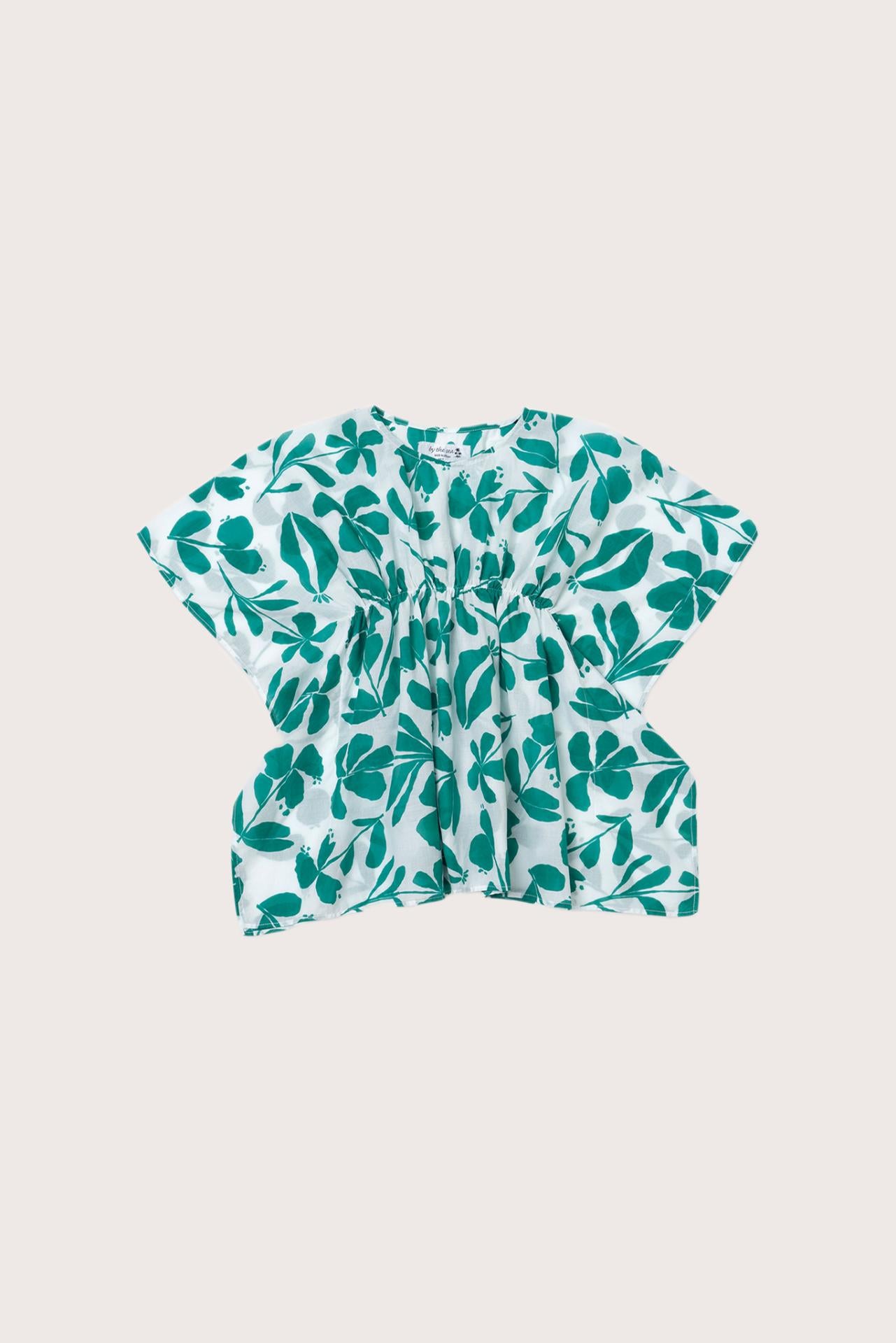Child wearing the green white cotton Kids Kaftan by By The Sea Bali