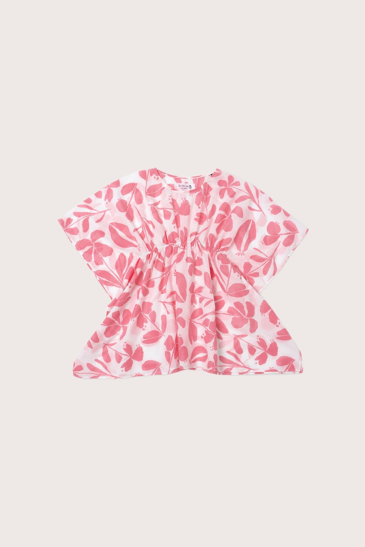 Child wearing the pink white cotton Kids Kaftan by By The Sea Bali