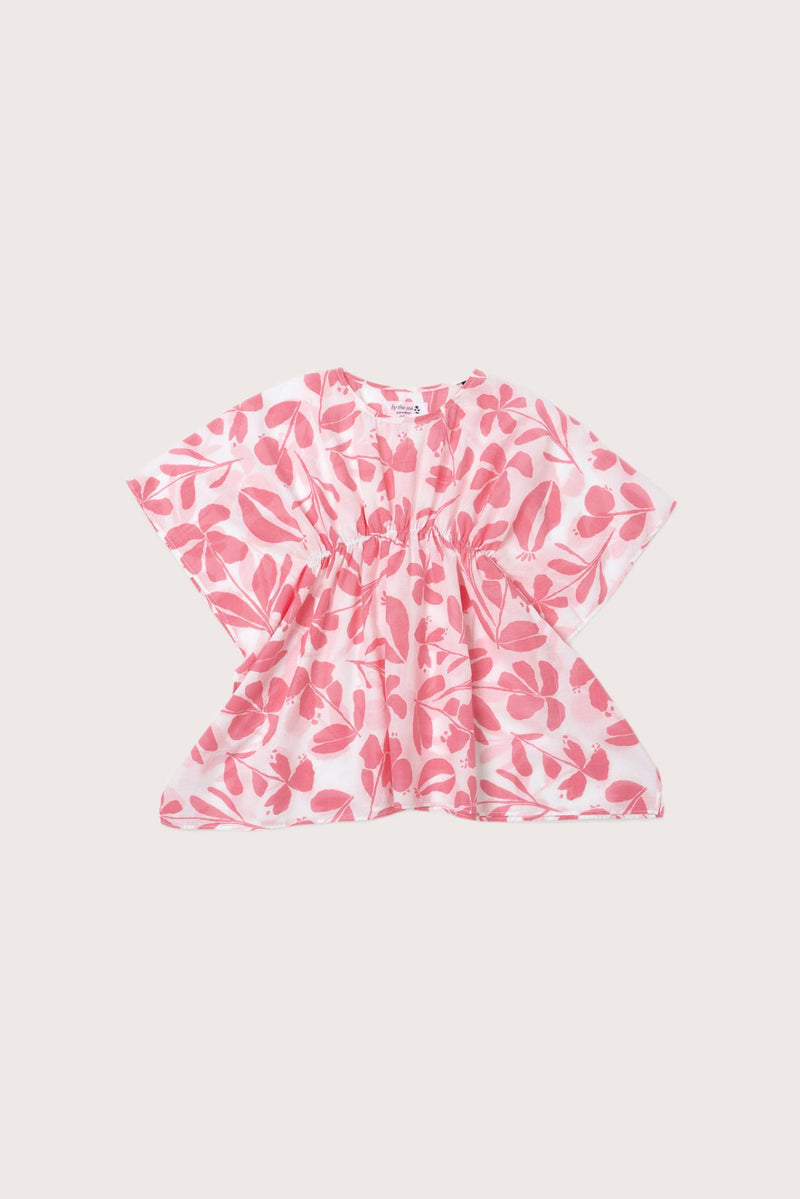 Child wearing the pink white cotton Kids Kaftan by By The Sea Bali