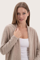 Close-up of the cashmere texture and premium detailing on the beige outerwear