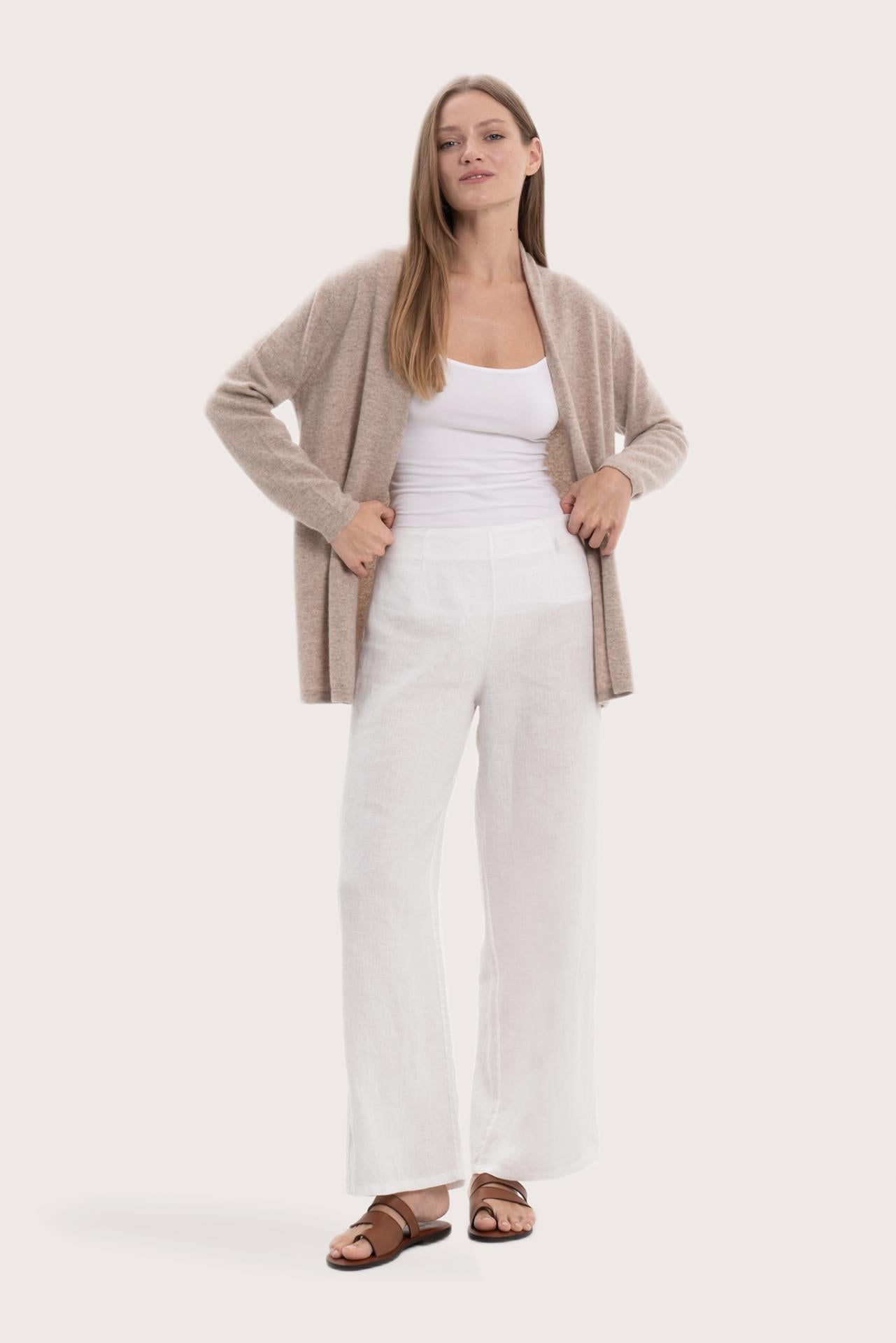 Model wearing the beige cashmere Klarr outerwear by By The Sea Bali