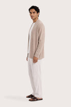 Side profile of a man wearing the beige cashmere Klarr outerwear