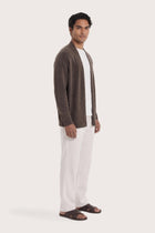Side profile of a man wearing the brown cashmere Klarr outerwear