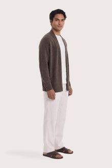 Side profile of a man wearing the brown cashmere Klarr outerwear