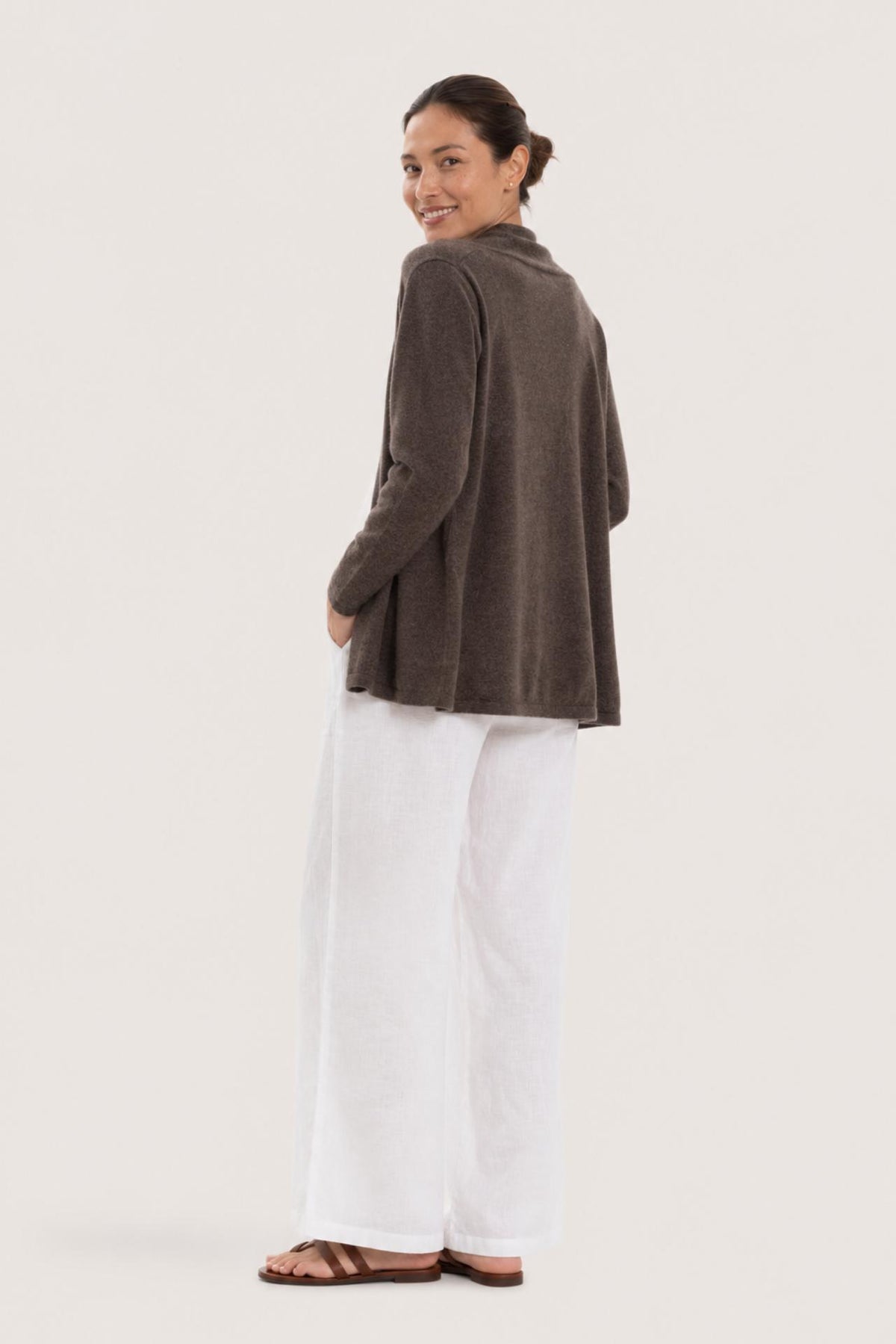Back view of a woman wearing the brown cashmere Klarr outerwear