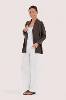 Side profile of a woman wearing the brown cashmere Klarr outerwear