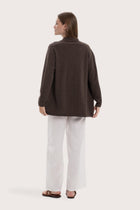 Back view of the grey cashmere outerwear with a relaxed and elegant silhouette