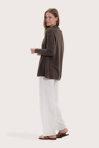 Side profile of the grey cashmere outerwear showcasing its soft drape and refined fit