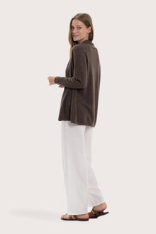 Side profile of the grey cashmere outerwear showcasing its soft drape and refined fit