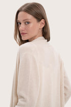 Detailed back view highlighting the elegant silhouette and cashmere craftsmanship