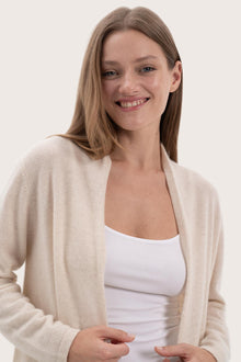 Close-up of the cashmere texture and premium detailing on the natural outerwear
