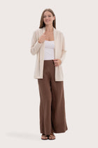 Model wearing the natural cashmere Klarr outerwear by By The Sea Bali