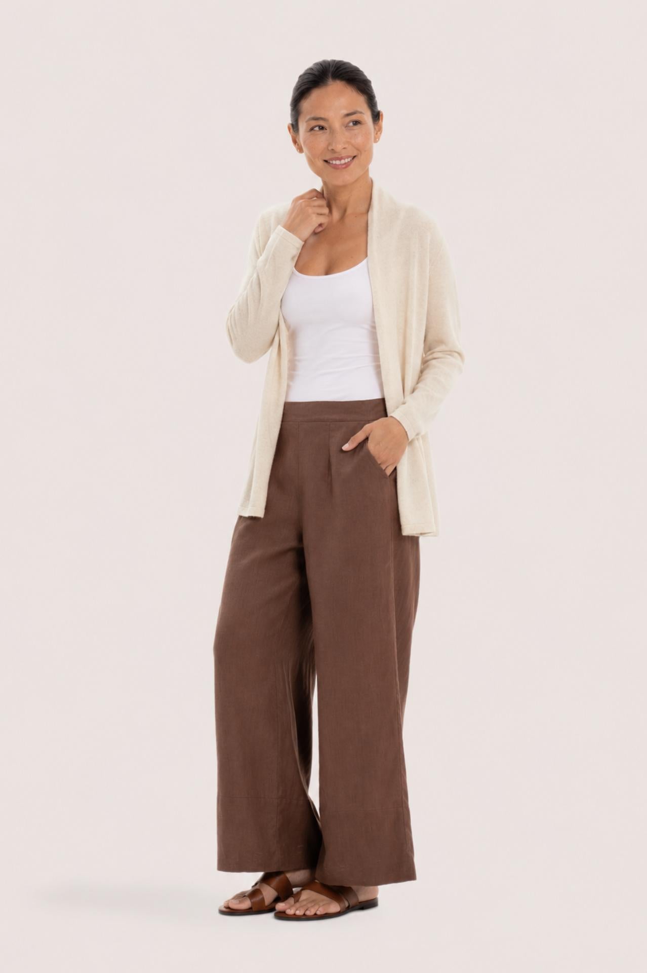 Woman wearing the natural cashmere Klarr outerwear by By The Sea Bali